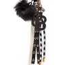 Berloque preto para mala com pompom e logótipo